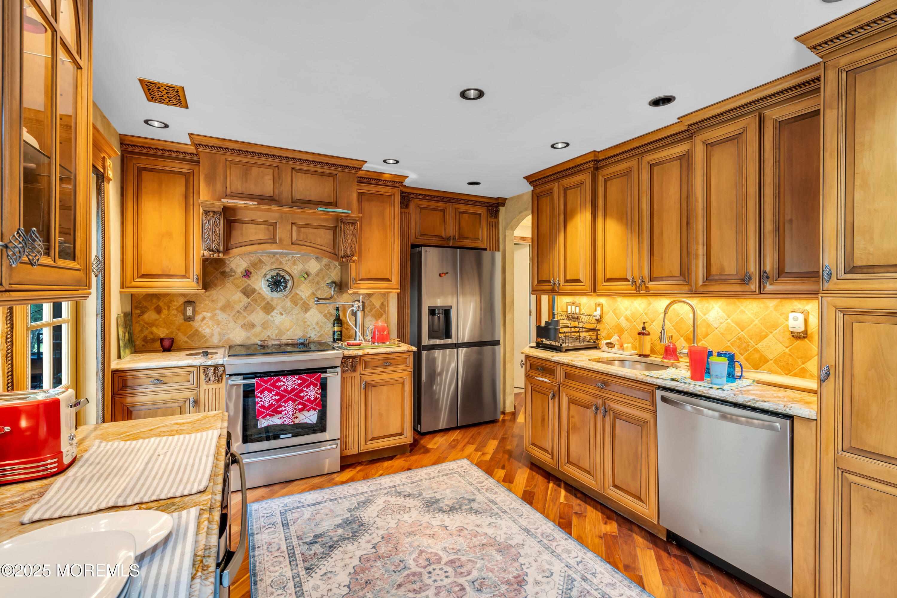 6 Hillcrest Road Manalapan, NJ 07726 - Photo 8 of 25 a kitchen with stainless steel appliances granite countertop a refrigerator and a stove top oven