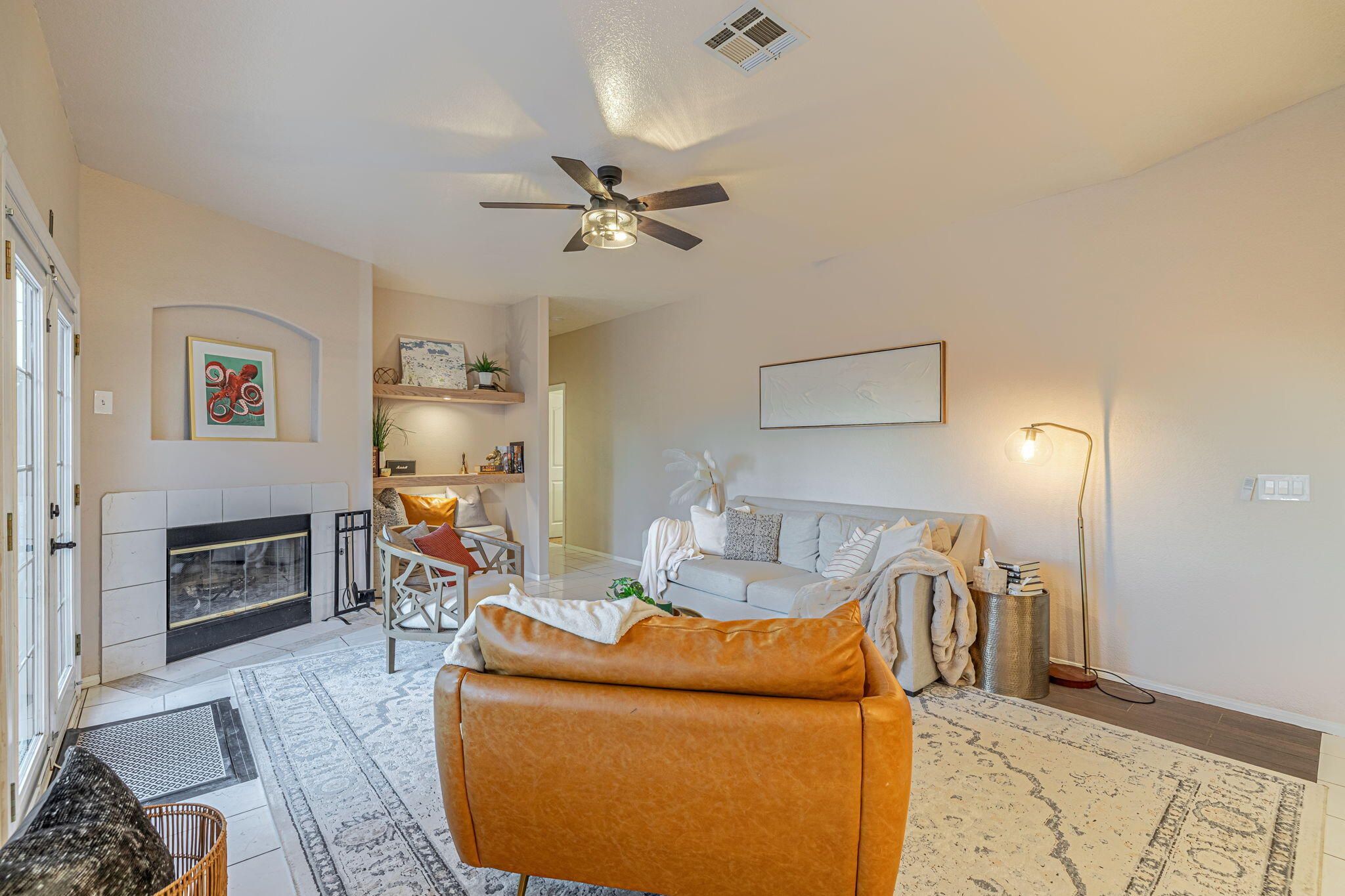 41002 Flagstone Street Palmdale, CA 93551 - Photo 15 of 57 a view of a livingroom with furniture and a ceiling fan