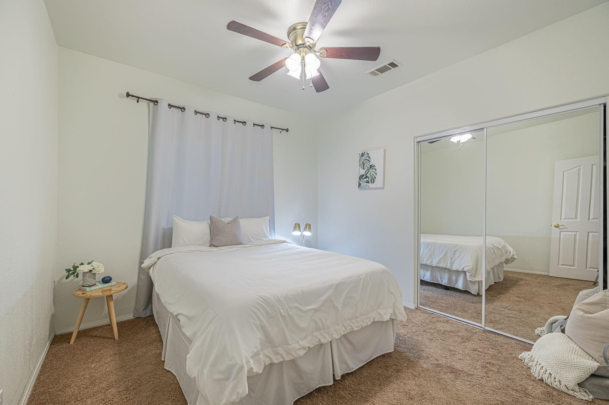 41002 Flagstone Street Palmdale, CA 93551 - Photo 22 of 57 a bedroom with a bed and a couch
