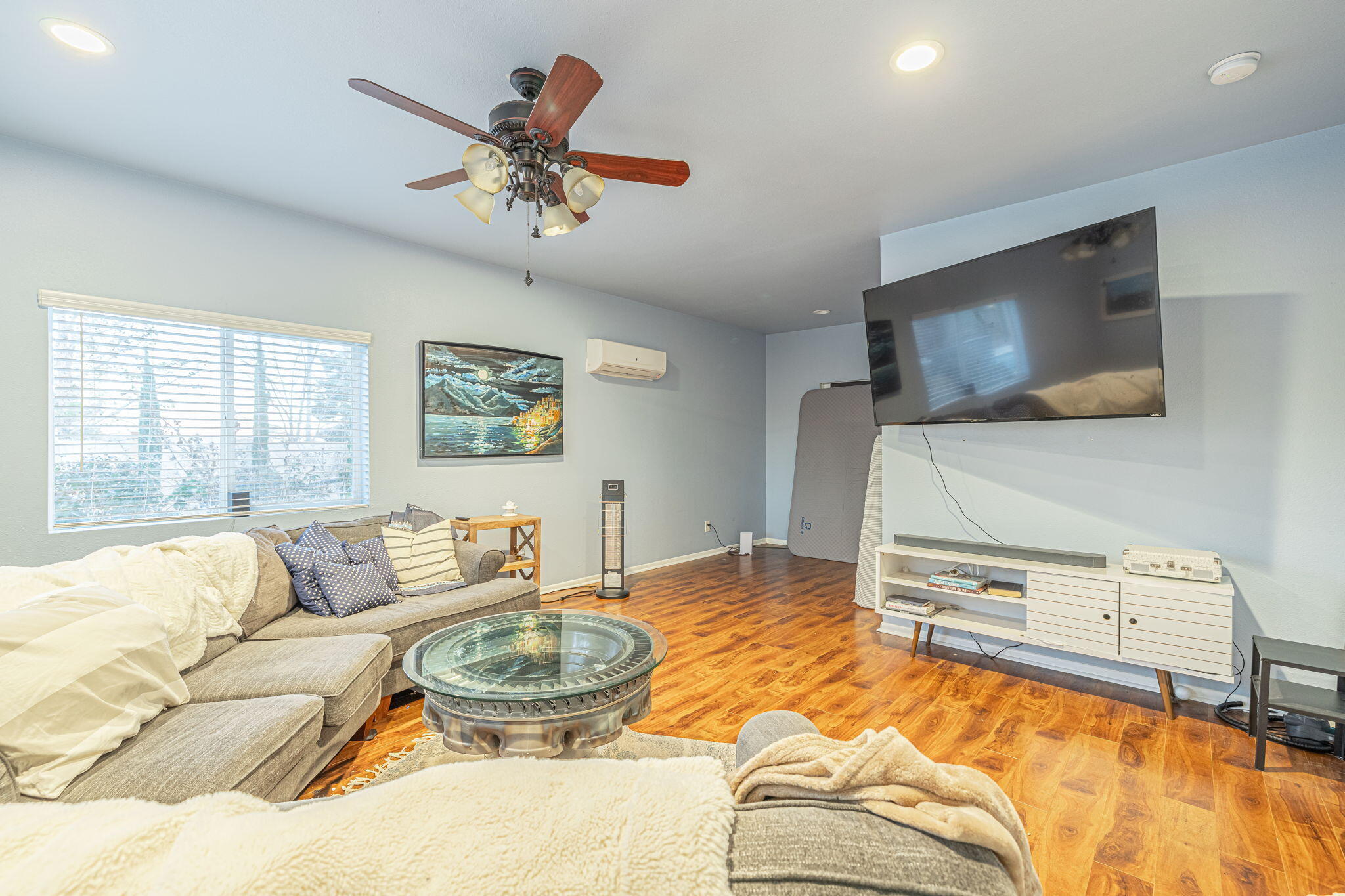 41002 Flagstone Street Palmdale, CA 93551 - Photo 26 of 57 a living room with furniture and a flat screen tv