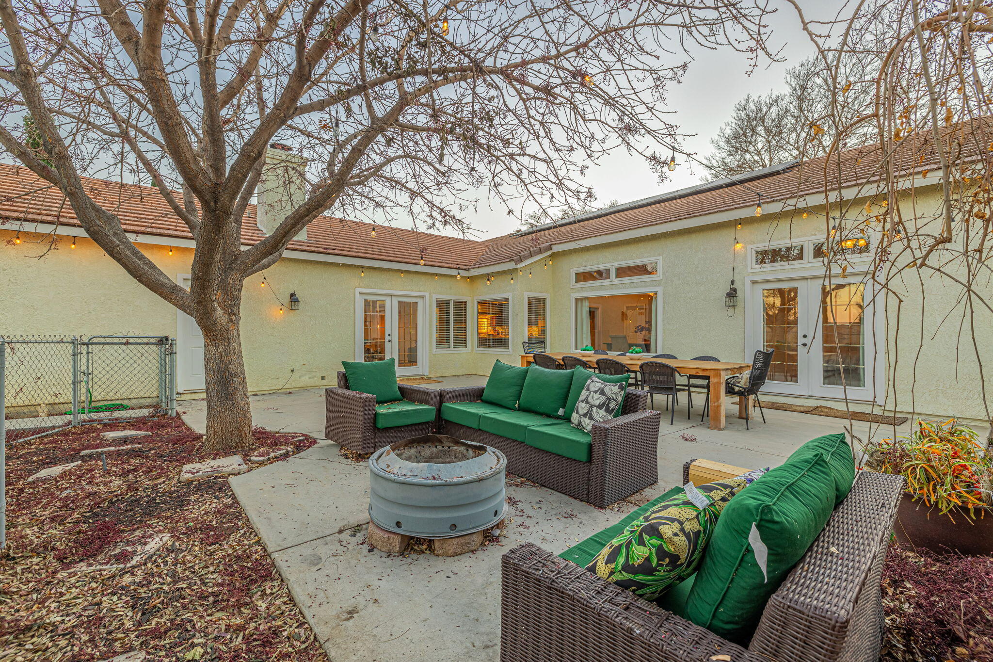 41002 Flagstone Street Palmdale, CA 93551 - Photo 28 of 57 a view of a patio with couches table and chairs and potted plants