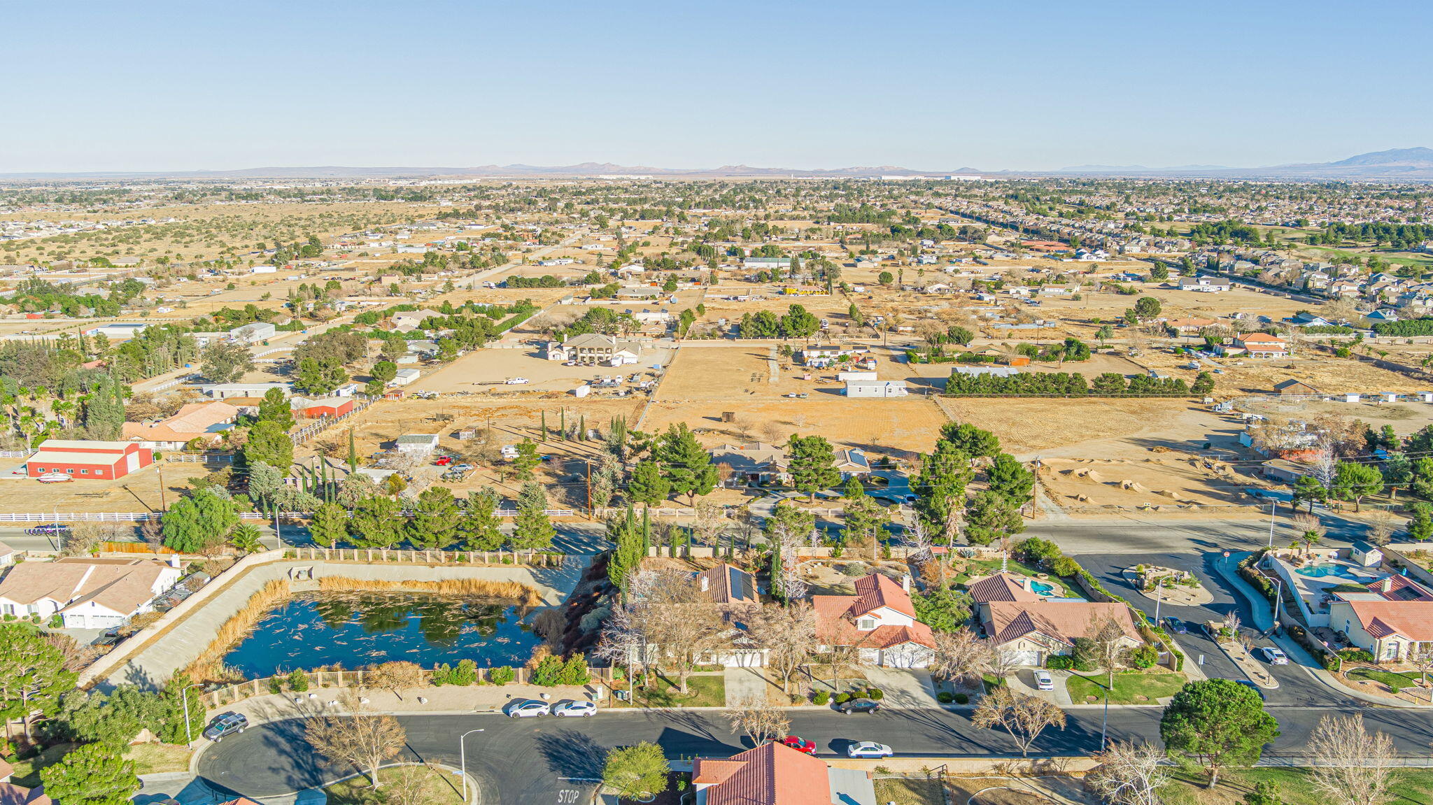 41002 Flagstone Street Palmdale, CA 93551 - Photo 37 of 57 an aerial view of residential building and lake