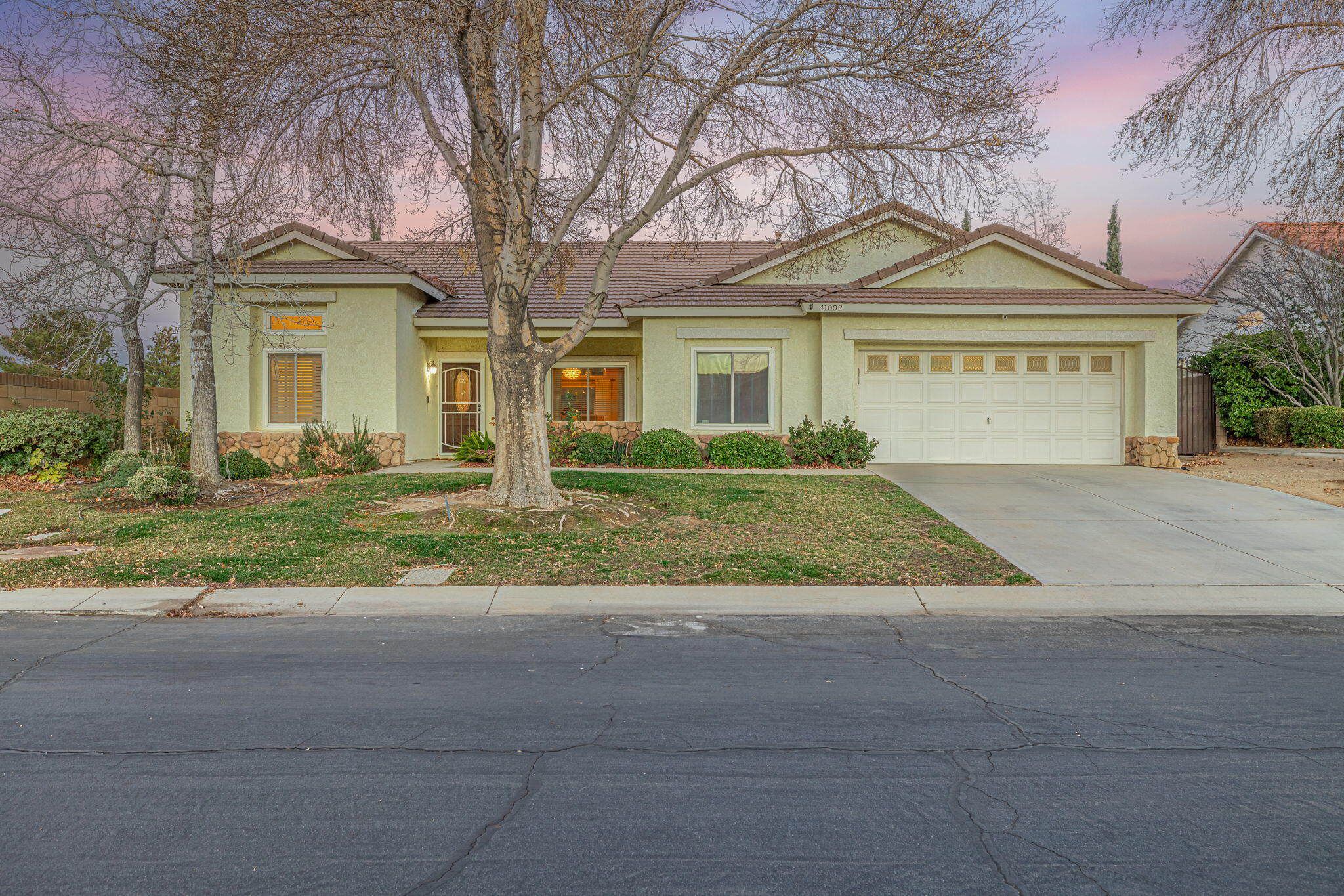 41002 Flagstone Street Palmdale, CA 93551 - Photo 43 of 57 front view of a house with a yard