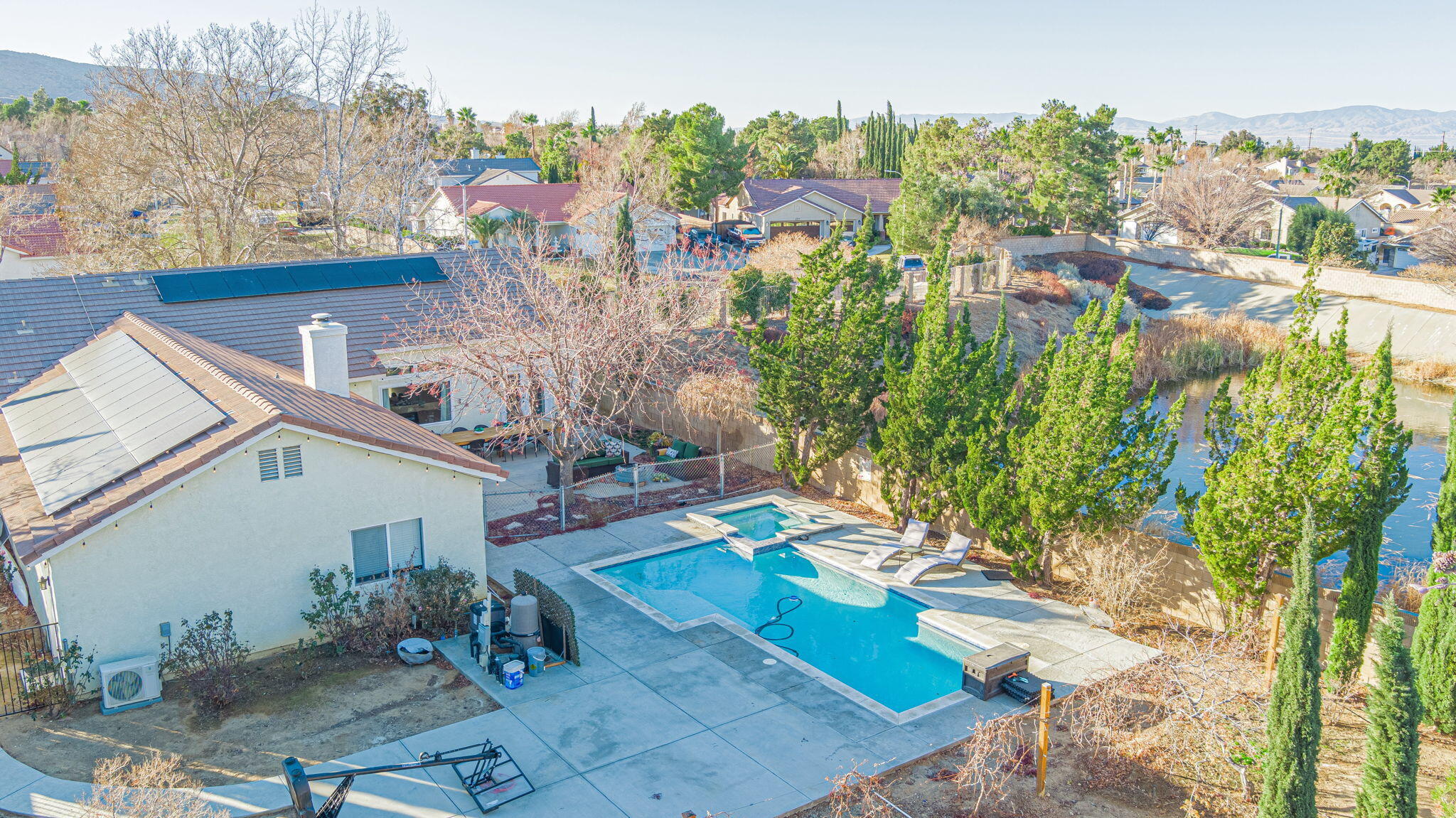 41002 Flagstone Street Palmdale, CA 93551 - Photo 54 of 57 a view of a backyard with plants and a patio