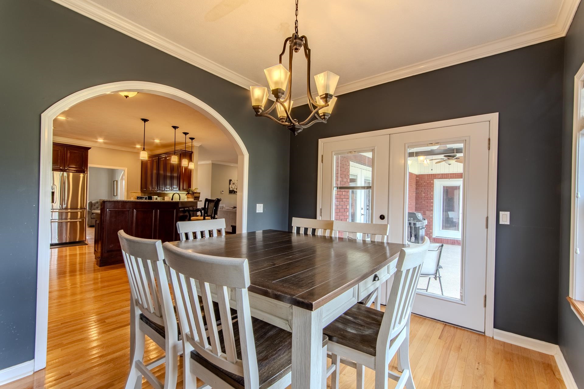 2705 Oak Grove Road Savannah, TN 38372 - Photo 11 of 40 a view of a dining room with furniture and a chandelier
