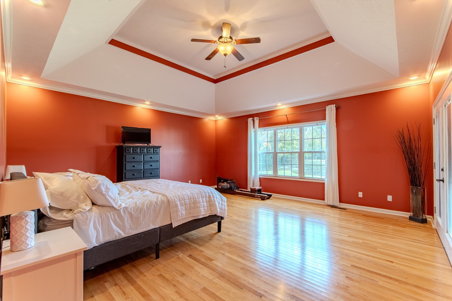 2705 Oak Grove Road Savannah, TN 38372 - Photo 17 of 40 a bedroom with a bed and a chandelier