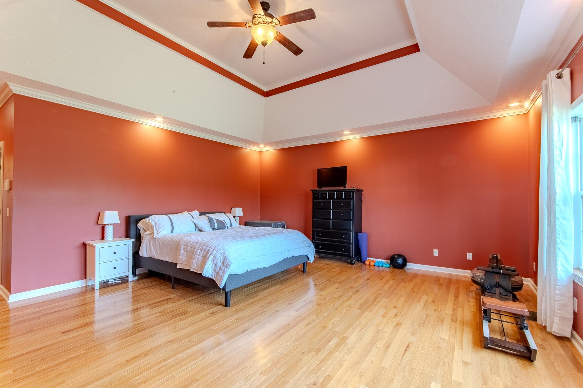 2705 Oak Grove Road Savannah, TN 38372 - Photo 18 of 40 a bedroom with a bed and a chandelier