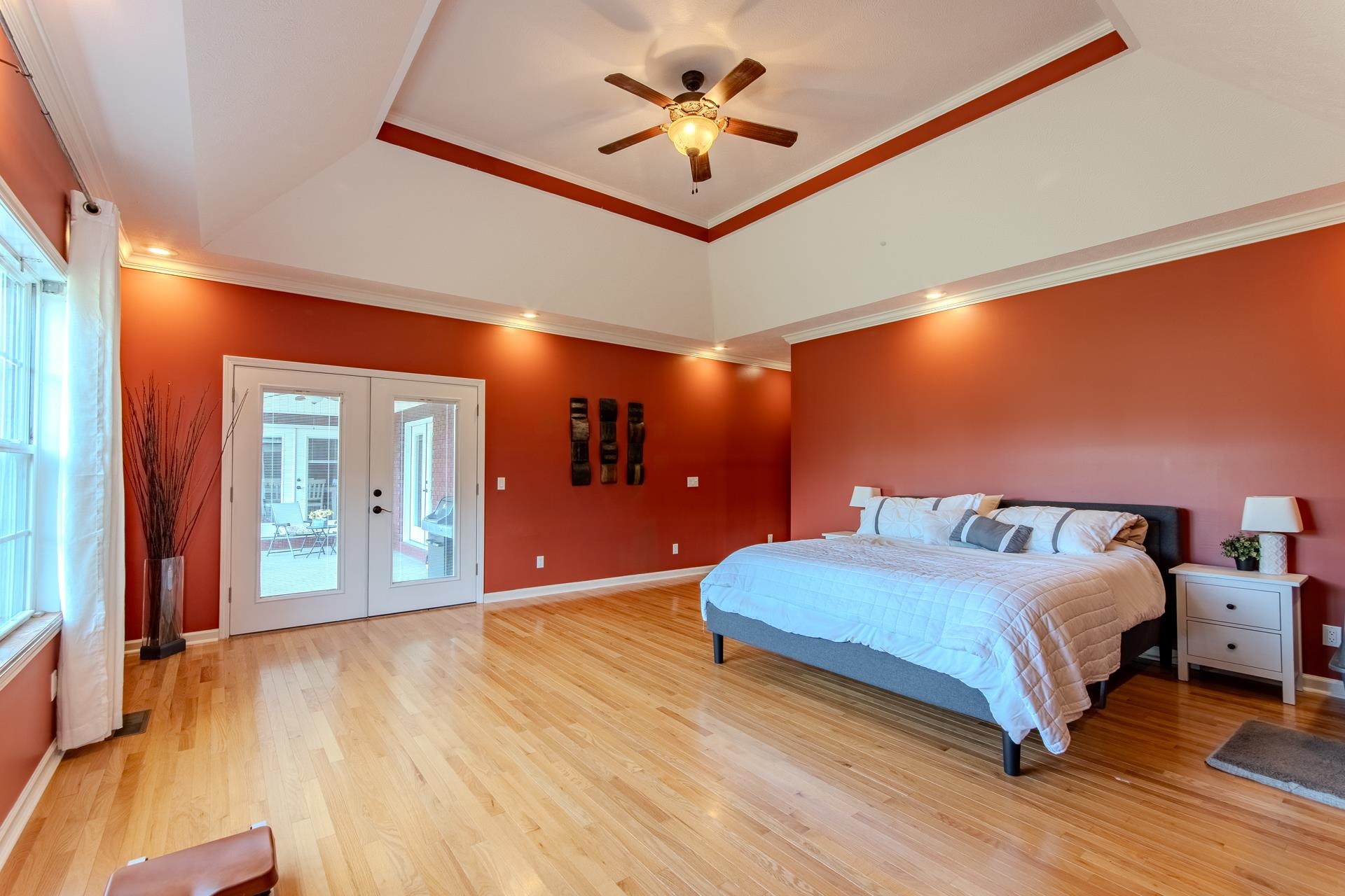 2705 Oak Grove Road Savannah, TN 38372 - Photo 19 of 40 a bedroom with a bed and a chandelier