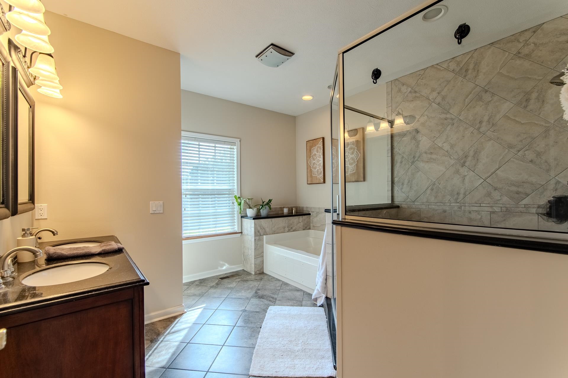 2705 Oak Grove Road Savannah, TN 38372 - Photo 21 of 40 a bathroom with a sink a bathtub and a shower