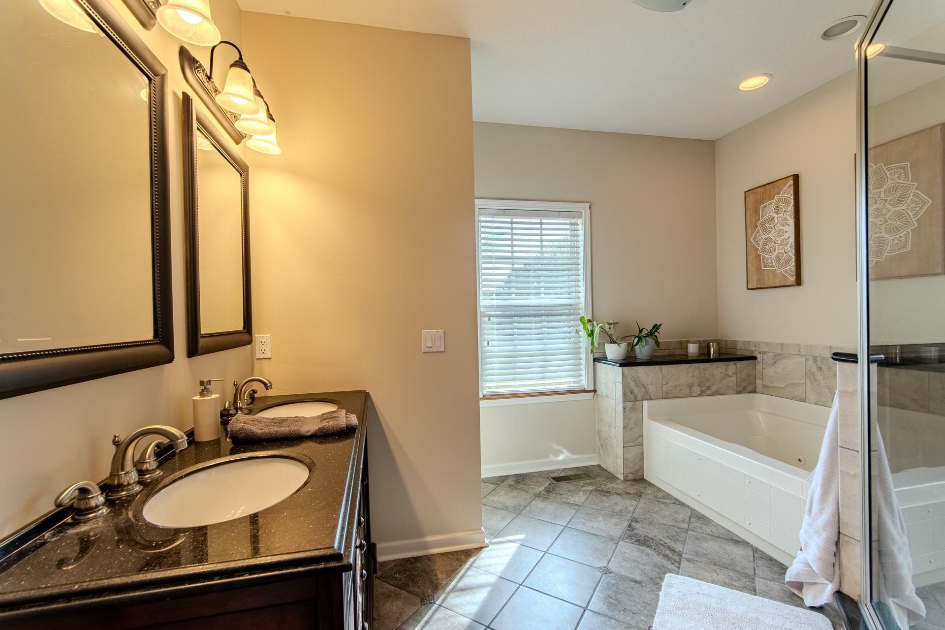 2705 Oak Grove Road Savannah, TN 38372 - Photo 22 of 40 a bathroom with a tub sink and mirror