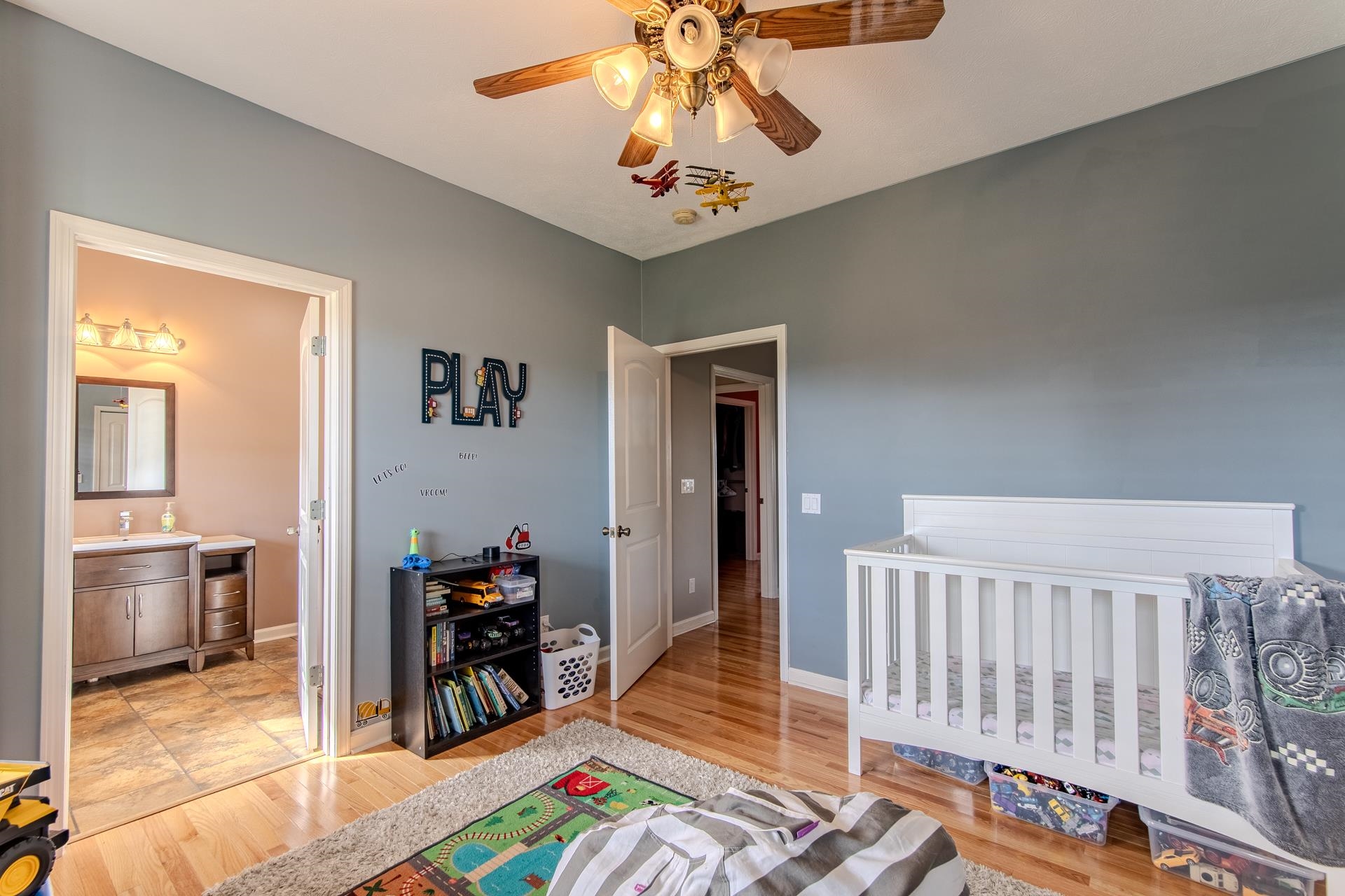 2705 Oak Grove Road Savannah, TN 38372 - Photo 25 of 40 a living room with baby crib furniture and a dining table
