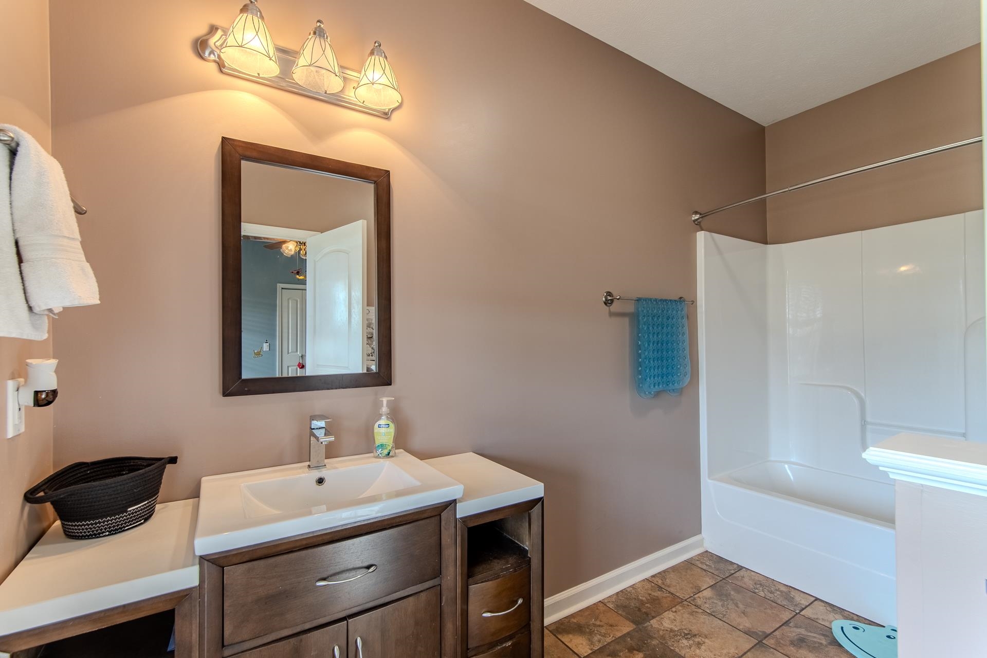 2705 Oak Grove Road Savannah, TN 38372 - Photo 26 of 40 a bathroom with a sink and a mirror