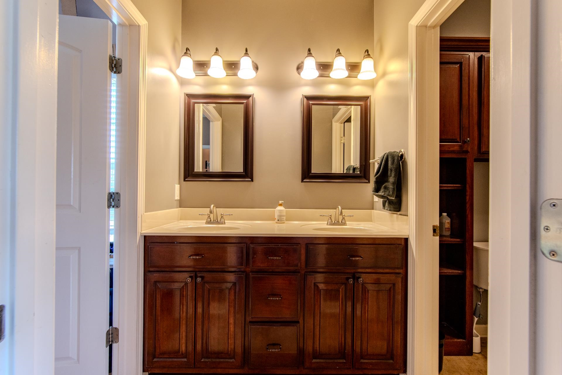 2705 Oak Grove Road Savannah, TN 38372 - Photo 30 of 40 a bathroom with double vanity sinks and a mirror