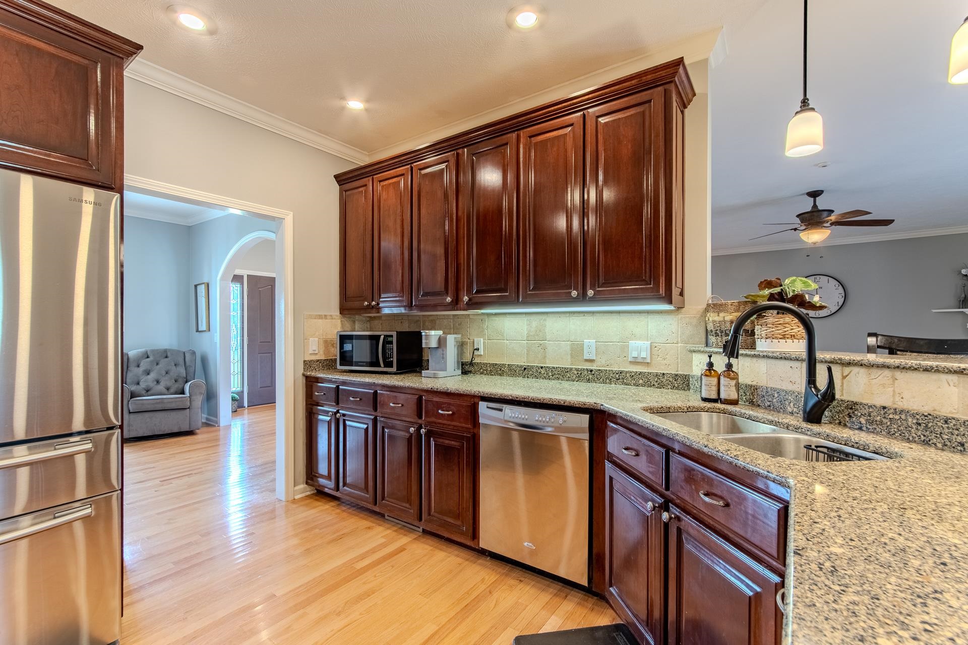 2705 Oak Grove Road Savannah, TN 38372 - Photo 3 of 40 a kitchen with stainless steel appliances granite countertop wooden cabinets a sink and dishwasher