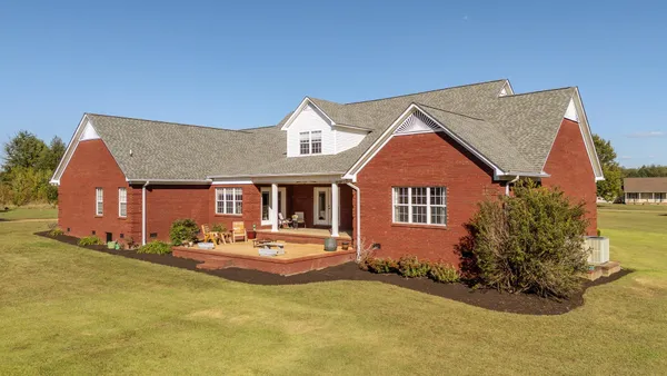 a front view of a house with swimming pool