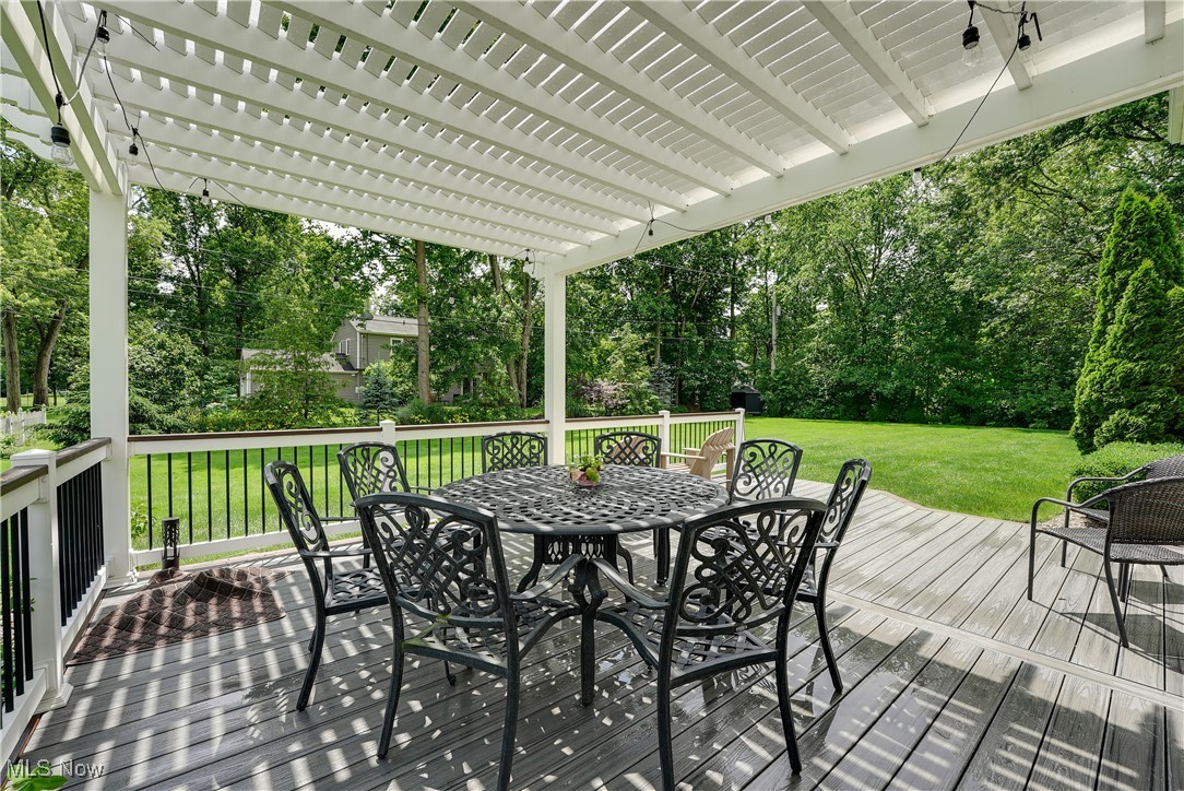 1862 Middleton Road Hudson, OH 44236 - Photo 27 of 32 Wooden terrace featuring outdoor dining space, a pergola, a yard, and view of scattered trees