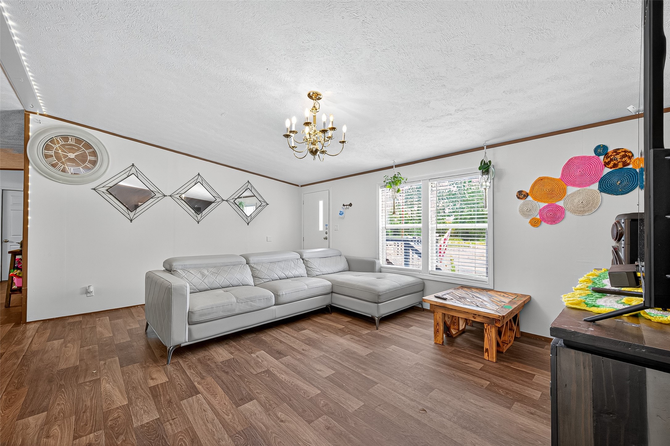 12514 County Road 3740 Cleveland, TX 77327 - Photo 13 of 31 a living room with furniture and wooden floor