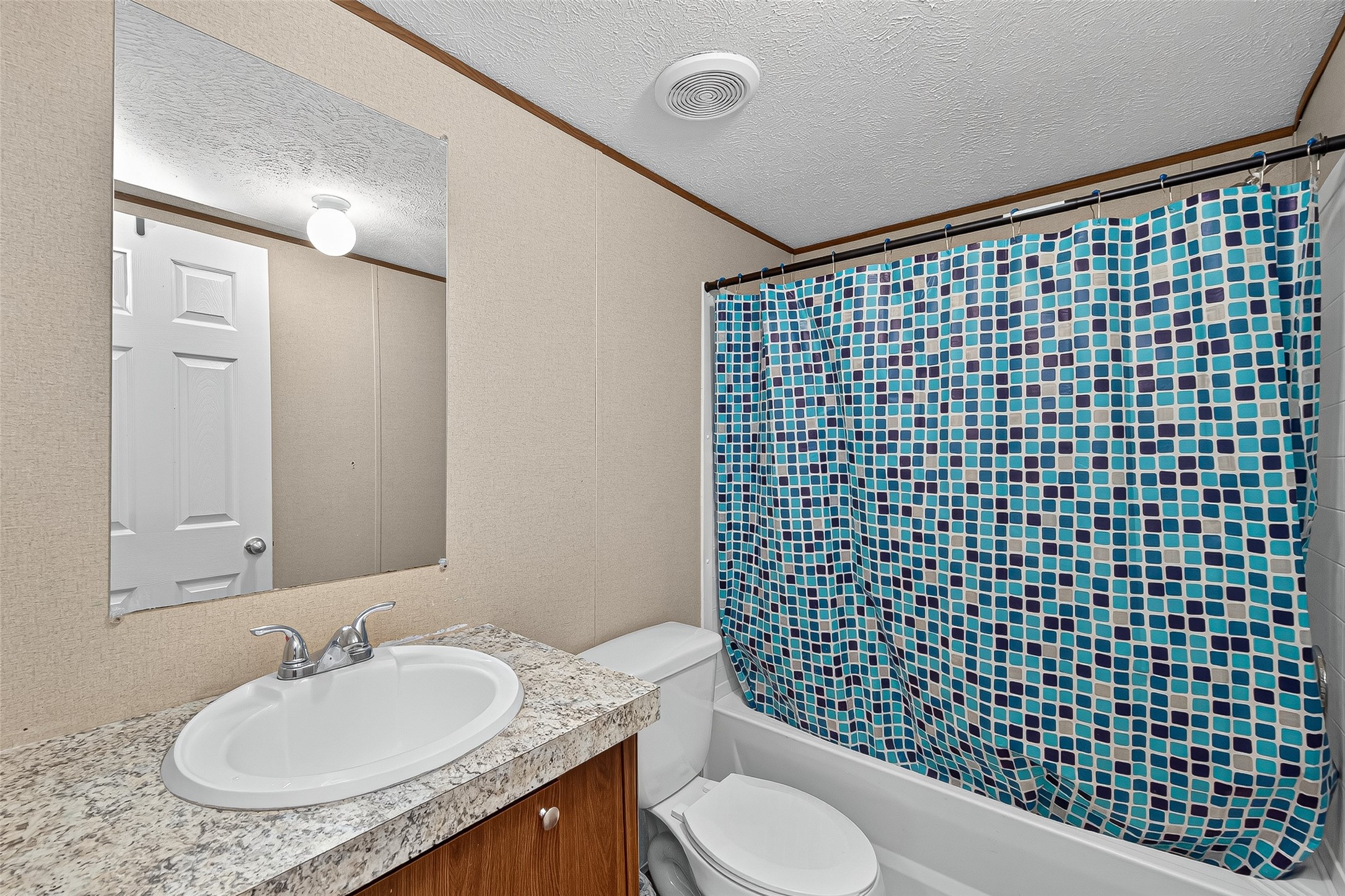 12514 County Road 3740 Cleveland, TX 77327 - Photo 17 of 31 a bathroom with a granite countertop sink toilet and shower