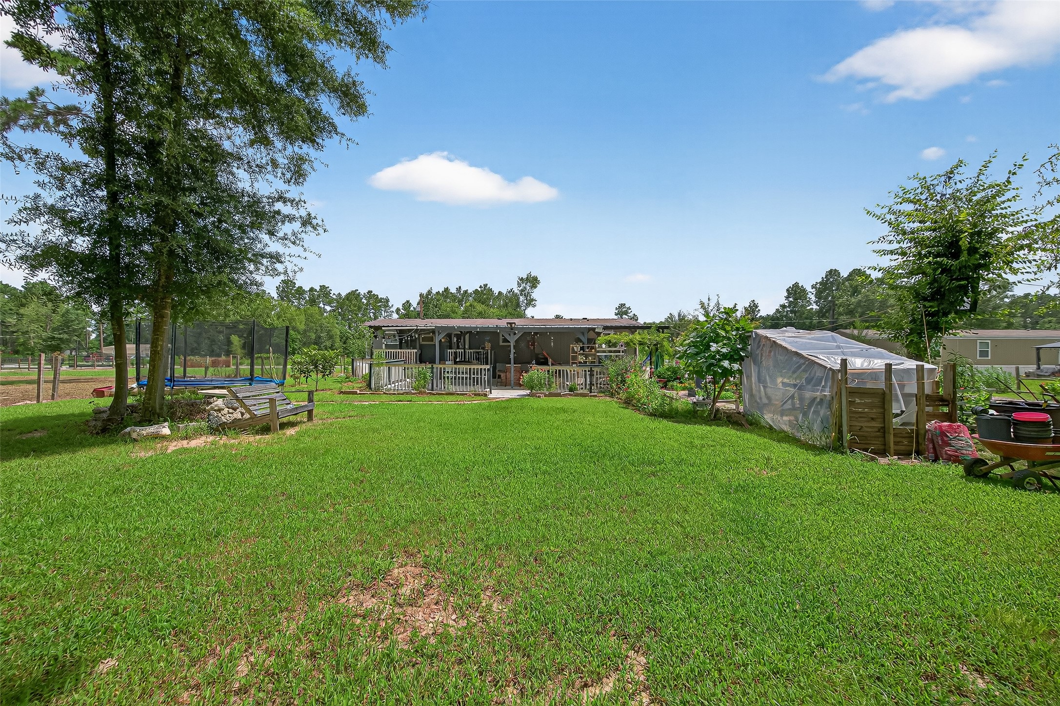 12514 County Road 3740 Cleveland, TX 77327 - Photo 23 of 31 a view of a garden with houses
