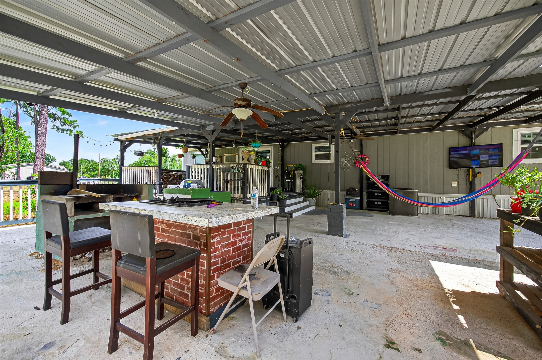 12514 County Road 3740 Cleveland, TX 77327 - Photo 25 of 31 a view of a room with gym equipment
