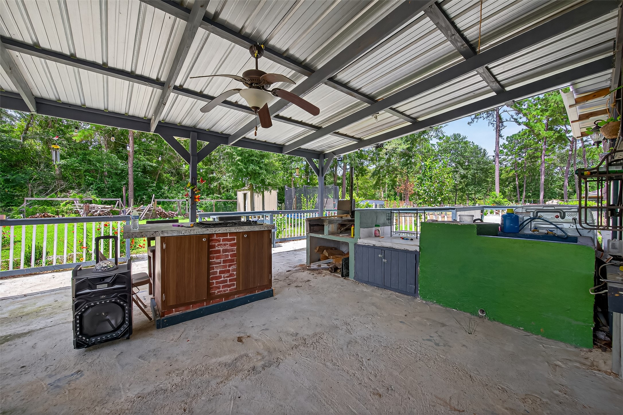 12514 County Road 3740 Cleveland, TX 77327 - Photo 31 of 31 a view of a backyard with sitting area