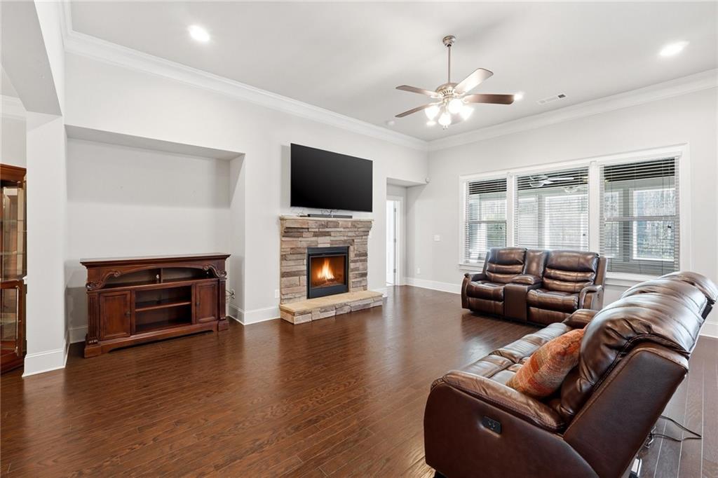 1810 Geranium Lane Cumming, GA 30040 - Photo 17 of 37 a living room with furniture fireplace and flat screen tv
