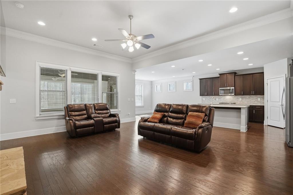 1810 Geranium Lane Cumming, GA 30040 - Photo 18 of 37 a living room with furniture and a chandelier