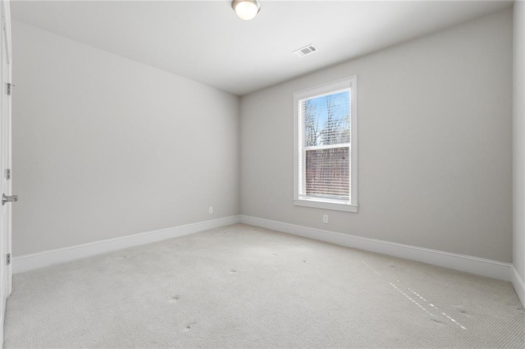 1810 Geranium Lane Cumming, GA 30040 - Photo 26 of 37 an empty room with a window