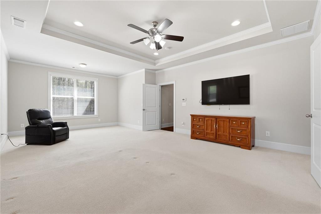 1810 Geranium Lane Cumming, GA 30040 - Photo 27 of 37 a living room with furniture and a flat screen tv