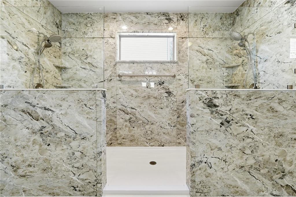 1810 Geranium Lane Cumming, GA 30040 - Photo 29 of 37 a bathroom with a shower and a sink