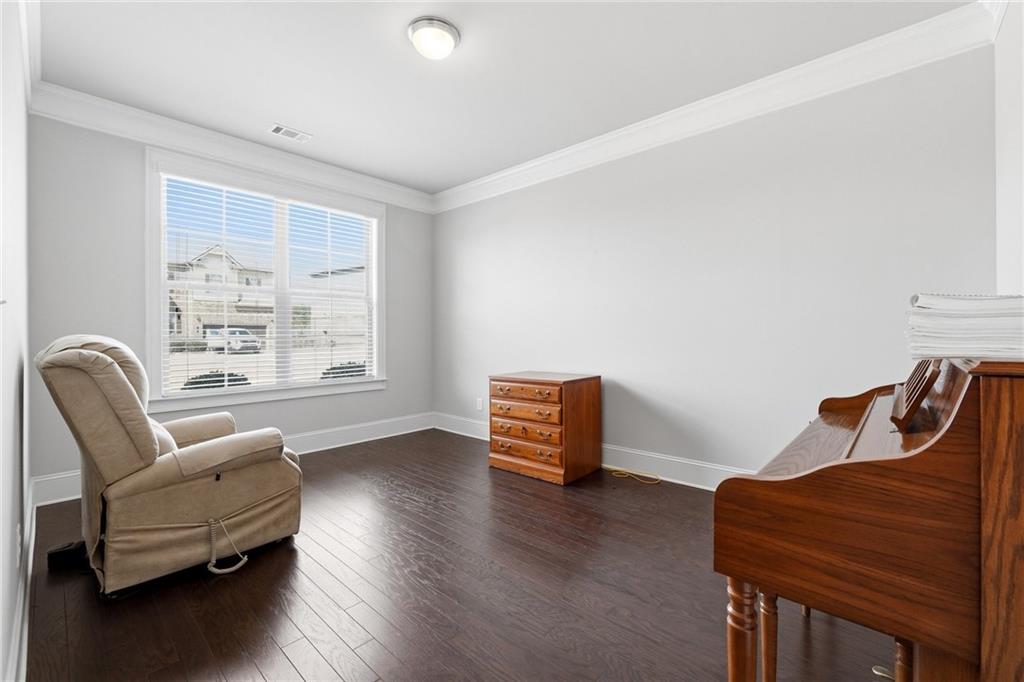 1810 Geranium Lane Cumming, GA 30040 - Photo 8 of 37 a living room with furniture and a window