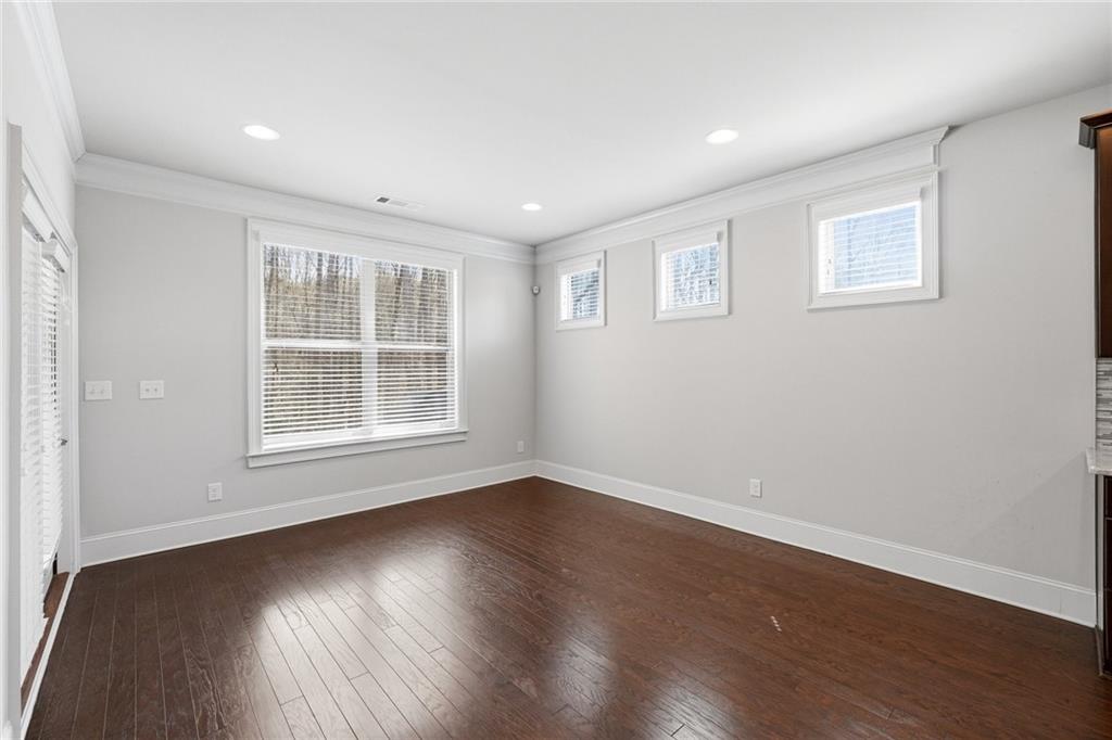 1810 Geranium Lane Cumming, GA 30040 - Photo 9 of 37 a view of empty room with wooden floor and fan