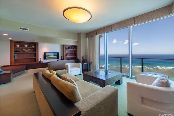 a living room with furniture and a large window