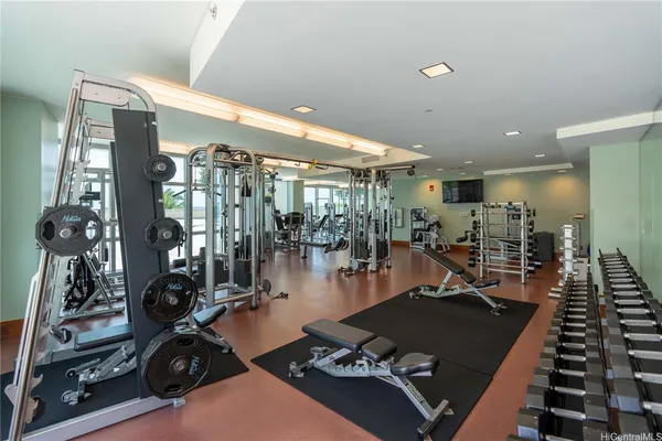 a room with lots of gym equipment