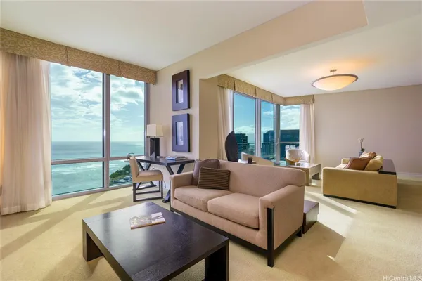 a living room with furniture and a large window