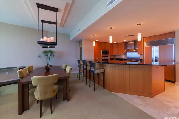 a dining room with furniture and window