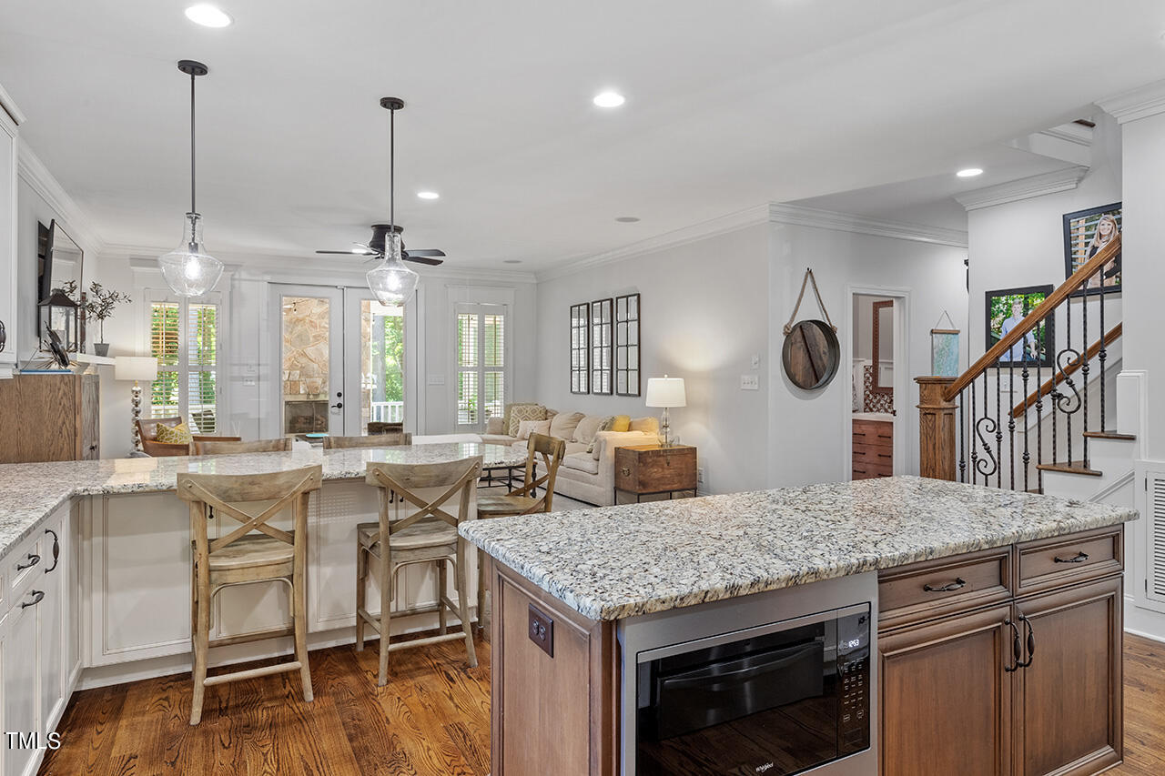 2016 Brassfield Road Raleigh, NC 27614 - Photo 11 of 44 a kitchen with a table chairs stove and kitchen view