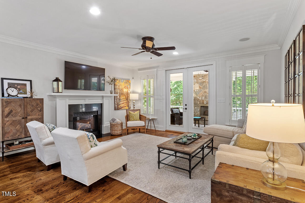 2016 Brassfield Road Raleigh, NC 27614 - Photo 12 of 44 a living room with furniture fireplace and a large window