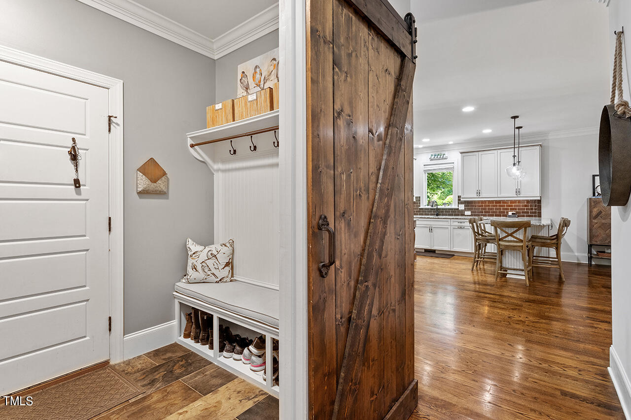 2016 Brassfield Road Raleigh, NC 27614 - Photo 15 of 44 a view of kitchen with furniture and wooden floor