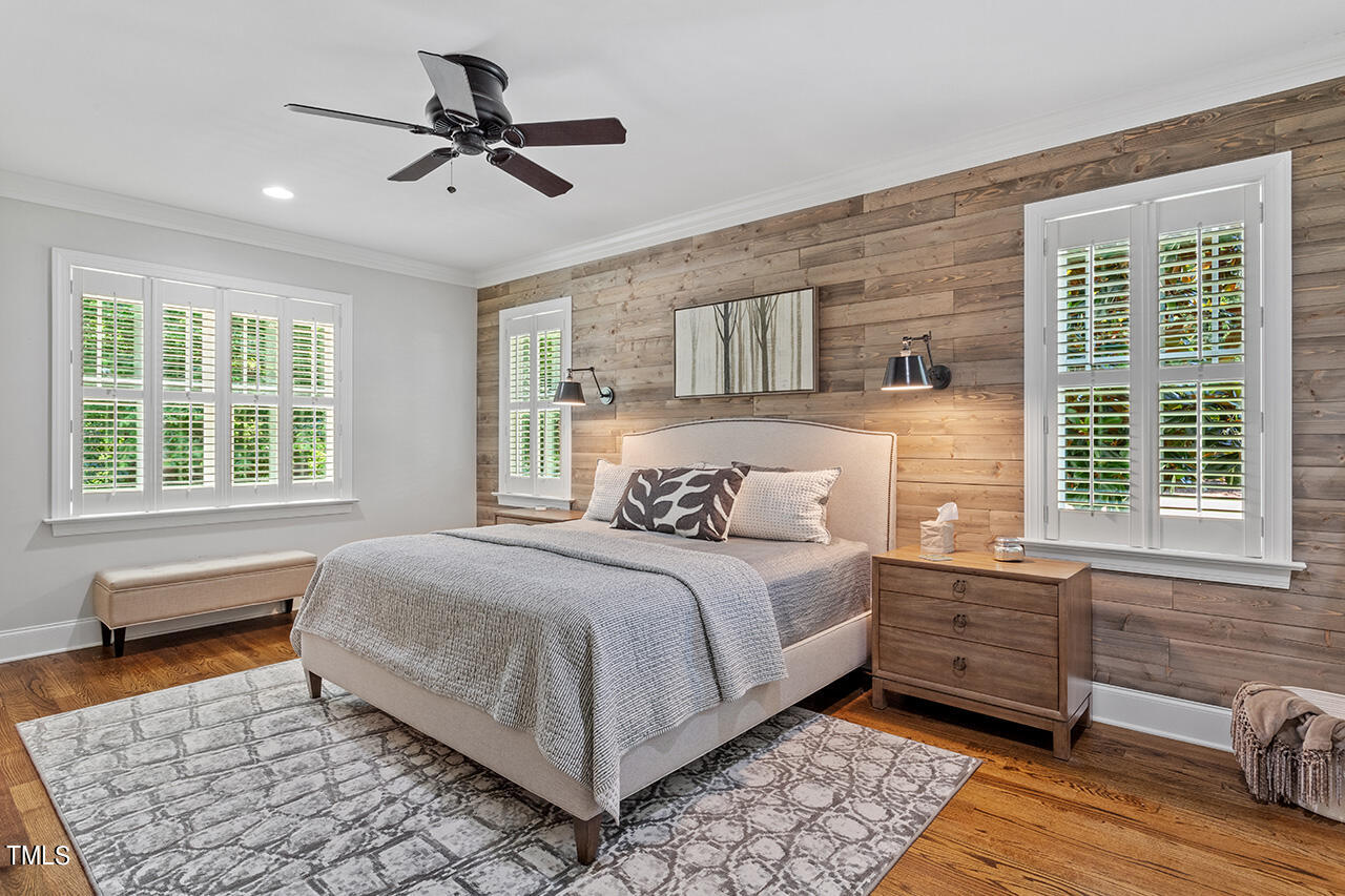 2016 Brassfield Road Raleigh, NC 27614 - Photo 17 of 44 a bedroom with a bed a window and potted plant