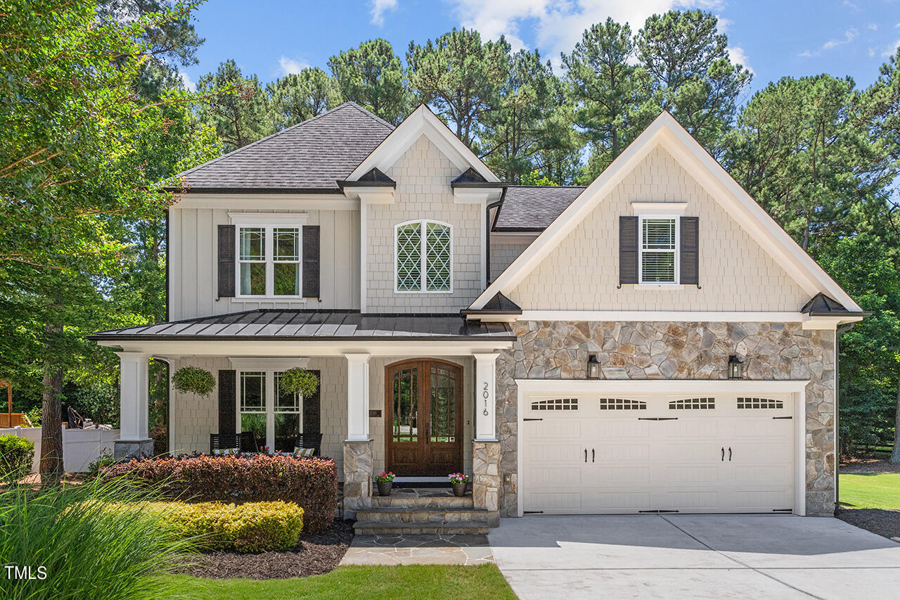 2016 Brassfield Road Raleigh, NC 27614 - Photo 2 of 44 a front view of a house with a yard