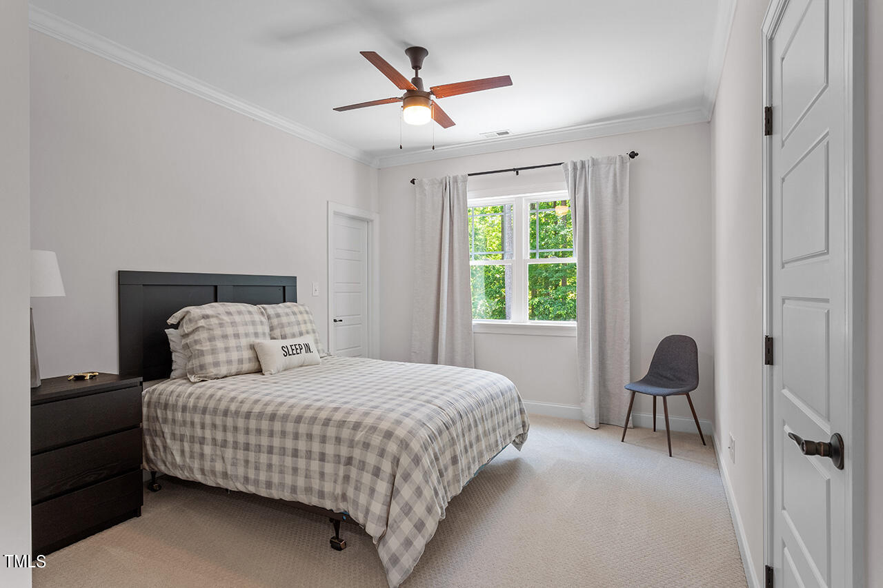 2016 Brassfield Road Raleigh, NC 27614 - Photo 30 of 44 a bedroom with a bed and a window