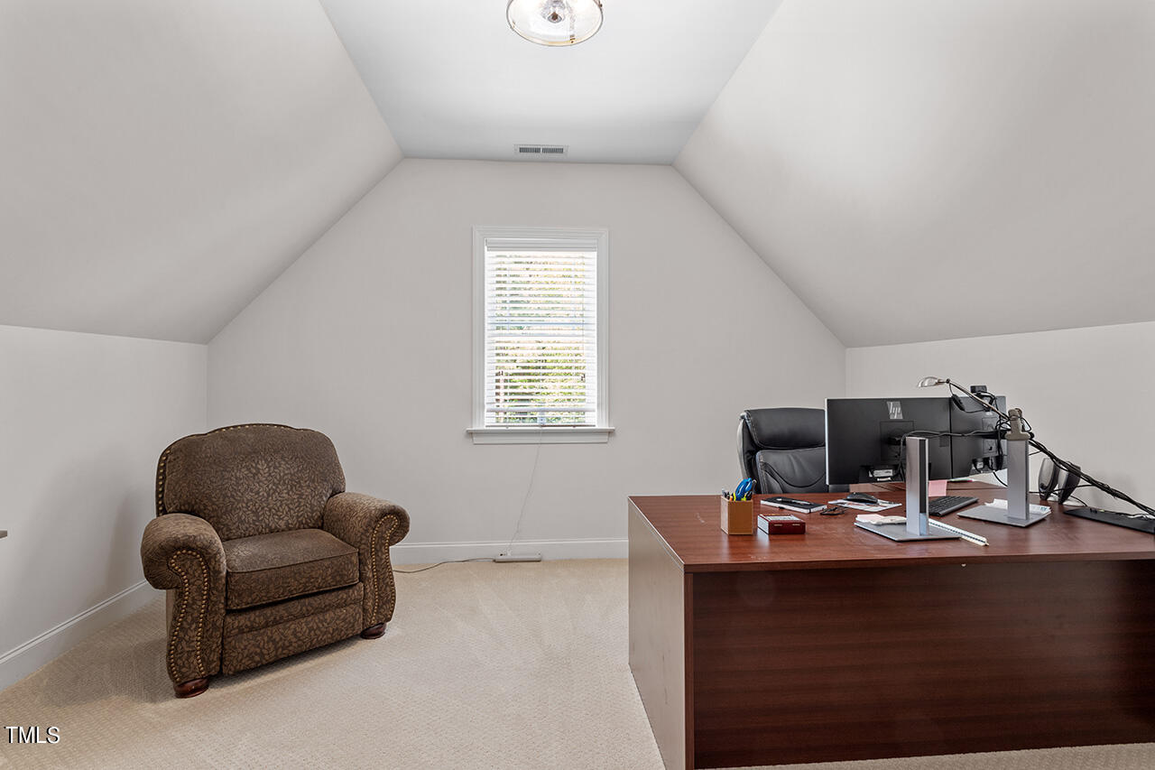 2016 Brassfield Road Raleigh, NC 27614 - Photo 33 of 44 a living room with furniture and a window