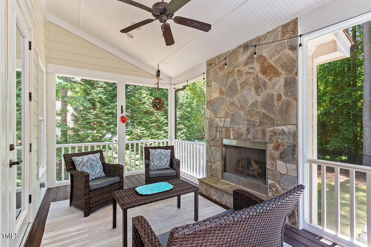 2016 Brassfield Road Raleigh, NC 27614 - Photo 34 of 44 a living room with furniture and a fireplace
