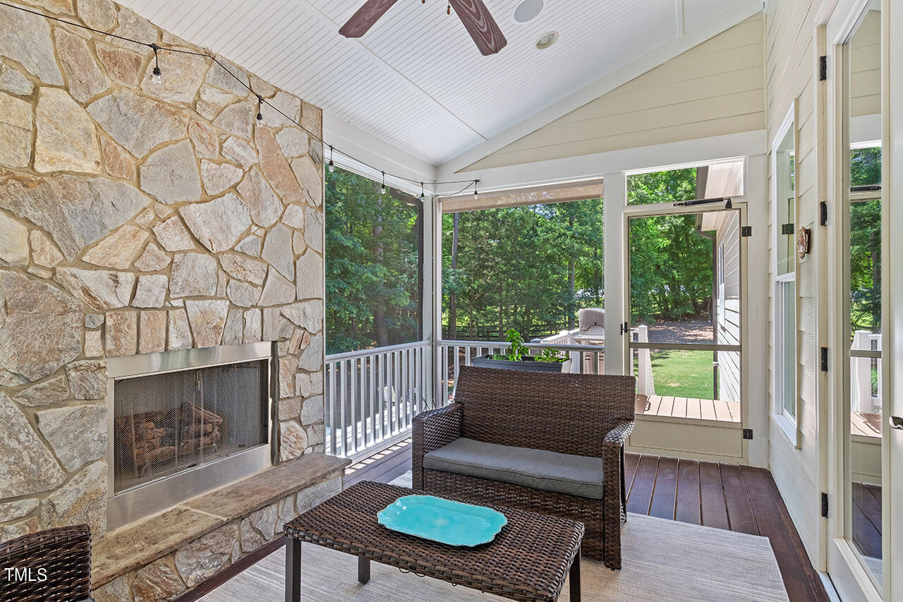 2016 Brassfield Road Raleigh, NC 27614 - Photo 35 of 44 a living room with furniture and a fireplace