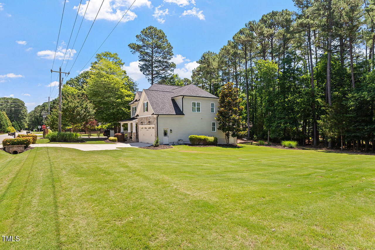 2016 Brassfield Road Raleigh, NC 27614 - Photo 38 of 44 a house view with swimming pool in front of it