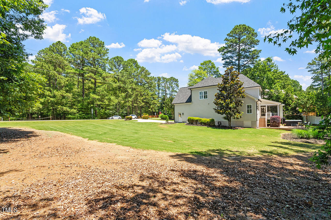 2016 Brassfield Road Raleigh, NC 27614 - Photo 39 of 44 a front view of a house with a yard and garage