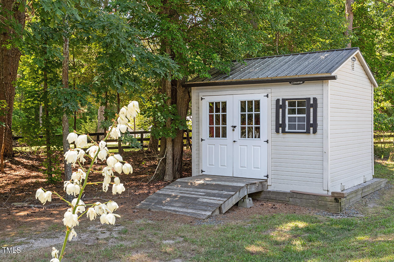 2016 Brassfield Road Raleigh, NC 27614 - Photo 40 of 44 a view of a house with a yard