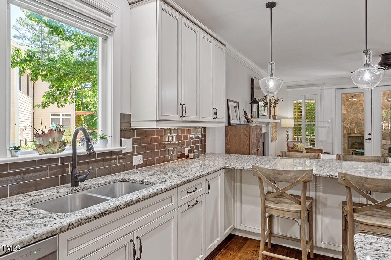 2016 Brassfield Road Raleigh, NC 27614 - Photo 7 of 44 a kitchen with granite countertop a sink a counter space appliances and cabinets