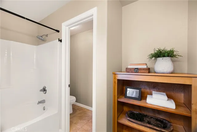 a view of room with a potted plant on the counter and cabinets